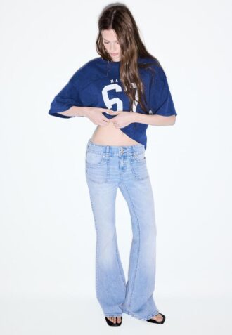 Jean taille basse avec poches passepoilées