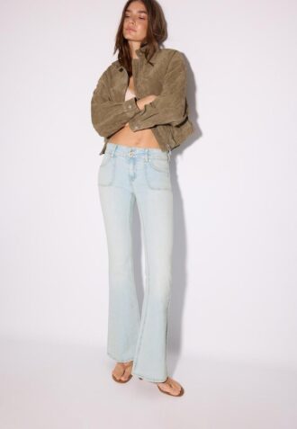 Jean taille basse avec poches passepoilées