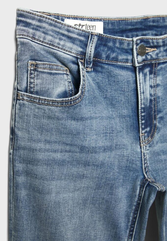 Jean taille basse à pattes d&rsquo;éléphant