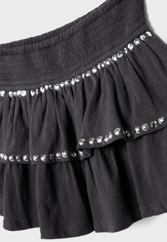 Mini-jupe à volants cloutée