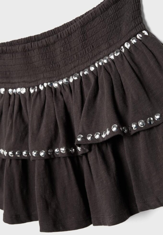 Mini-jupe à volants cloutée