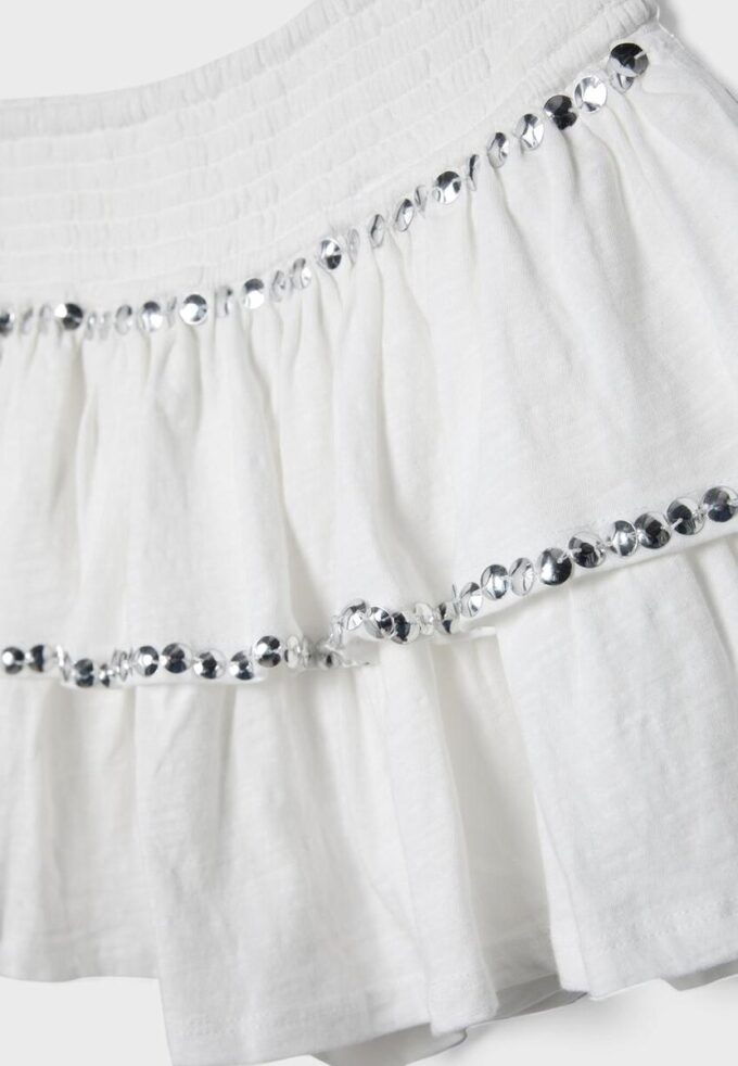 Mini-jupe à volants cloutée