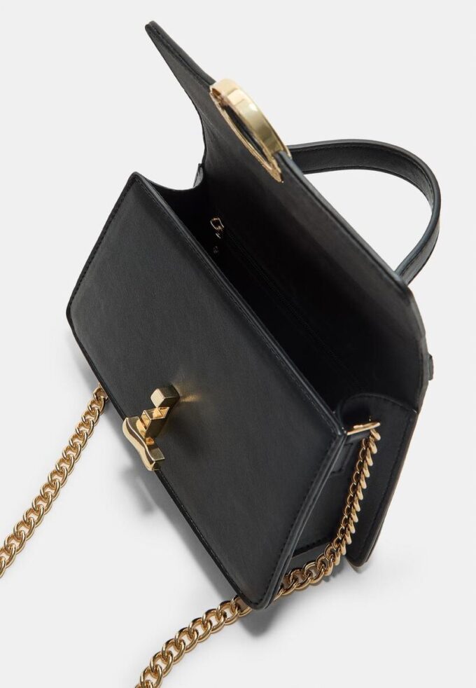 Sac à bandoulière à fermoir rond