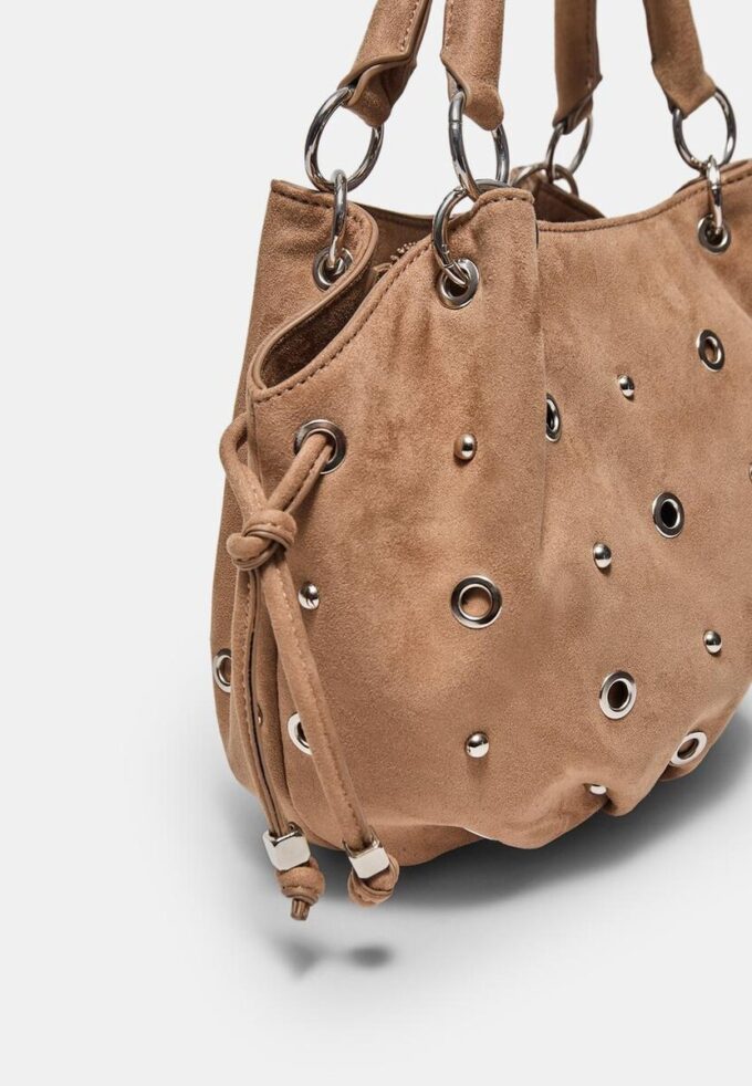 Sac à bandoulière rond avec détails à œillets