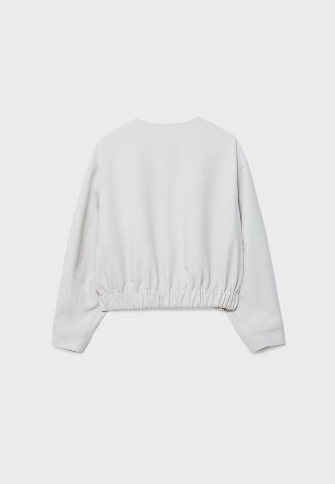 Veste à col rond et manches bouffantes