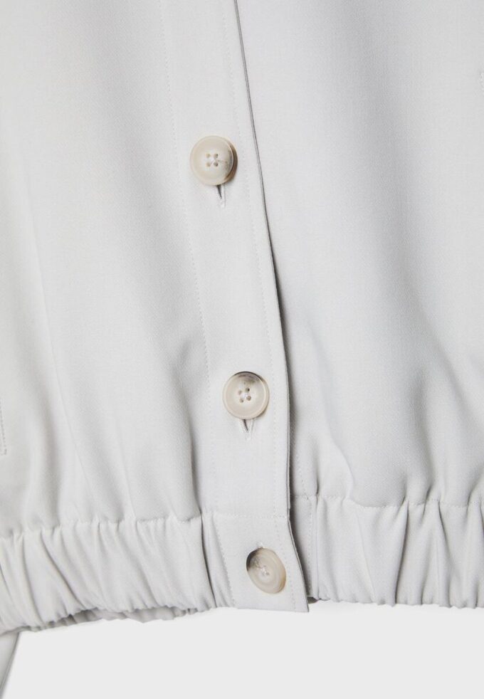 Veste à col rond et manches bouffantes